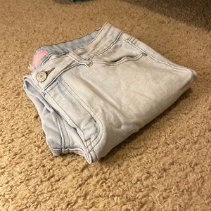 Light blue slightly ripped jeans